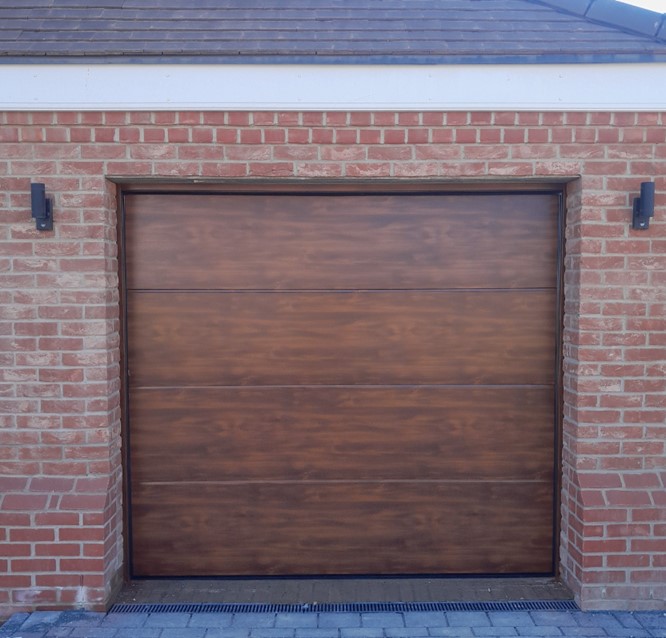 Novoferm UK - ISO45 45mm Flush Woodgrain insulated vertical lift up & over sectional garage door