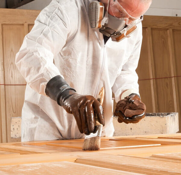 Person laminating the wooden door